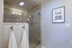 Combined shower/tub, hair dryer, towels, soap