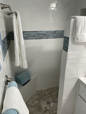 Shower, hair dryer, towels, soap