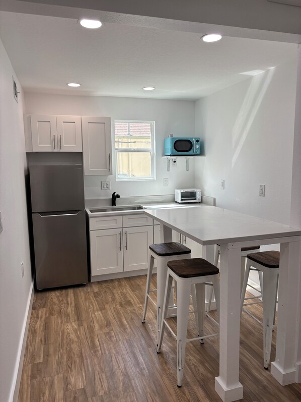 Fridge, microwave, coffee/tea maker, toaster