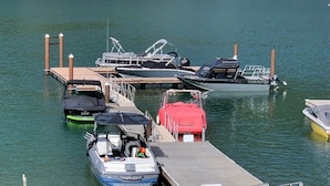 A marina with several boats docked at the pier. - Waterfront Home-Great Boating/Fishing/Beach. Mountain Views, close to Sandpoint (Sagle)