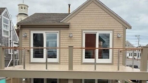 A two-story house with a balcony and a deck. - Spectacular Views in Center of Town and on the Beach! (Provincetown)