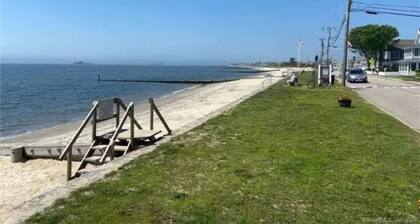 Walk to Beach, pool, tennis court and kids playscape.