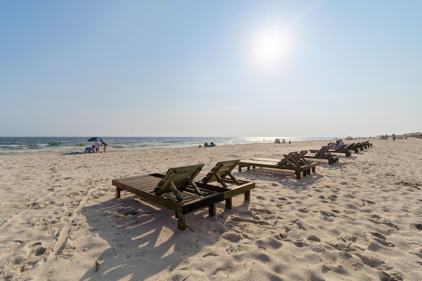 On the beach, sun-loungers, beach towels