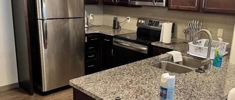 Microwave, dishwasher, cookware/dishes/utensils