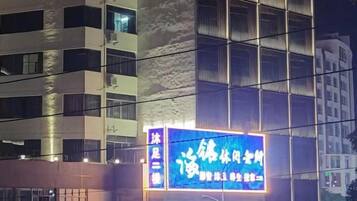 A building with a prominent illuminated sign.