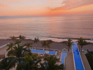 Outdoor pool, a heated pool - Beautiful Beachfront Apartment (Puerto Vallarta)