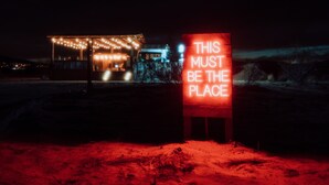 A neon sign with the text "THIS MUST BE THE PLACE" in a red-lit environment. - Private Luxury Glamping w/Celestial Views (Joshua Tree)