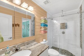 Shower, hair dryer, towels, shampoo