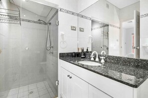 Bathtub, hair dryer, towels, soap