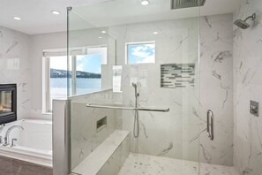 Bathtub, hair dryer, towels, shampoo