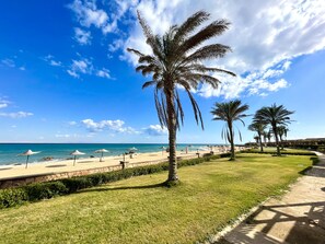 On the beach, sun-loungers