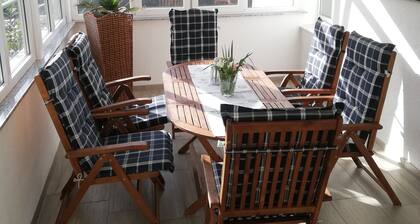 Vacation apartment on Lake Constance with conservatory, garden with barbecue house for up to 6 people.