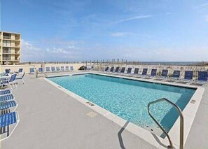Relax by the pool with a stunning ocean view.