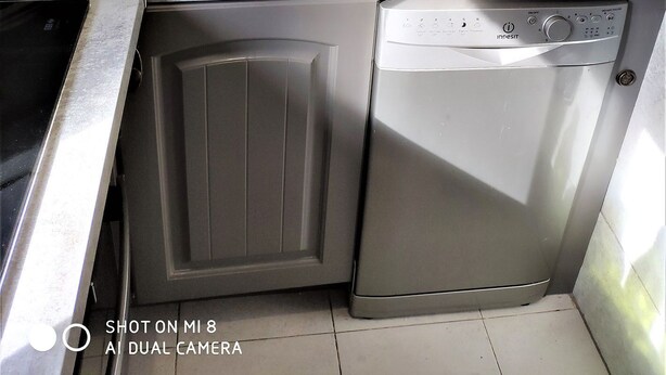 A compact kitchen with a stainless steel sink, a coffee maker, a microwave, and a dishwasher. - Village house 20 minutes from the beach (Piedicroce)