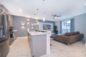 Enjoy a comfortable stay in this apartment with a sleek kitchen, central island, and flat-screen TV.