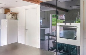 Fridge, stovetop, dishwasher, coffee/tea maker