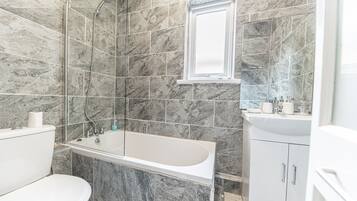 Combined shower/tub, hair dryer, towels, soap