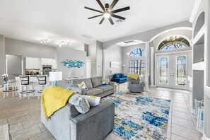 Relax in this open-plan living space with a kitchen, dining, and seating area.