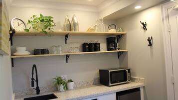 Microwave, stovetop, coffee/tea maker, electric kettle