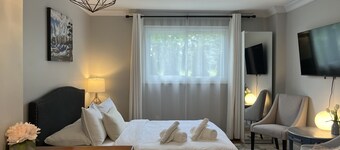 Stylish Main Level Suite with Separate Entrance, Private Patio and 2 Car Parking