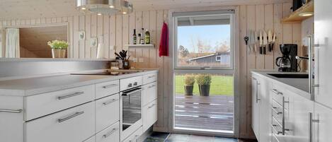 Fridge, stovetop, dishwasher, coffee/tea maker