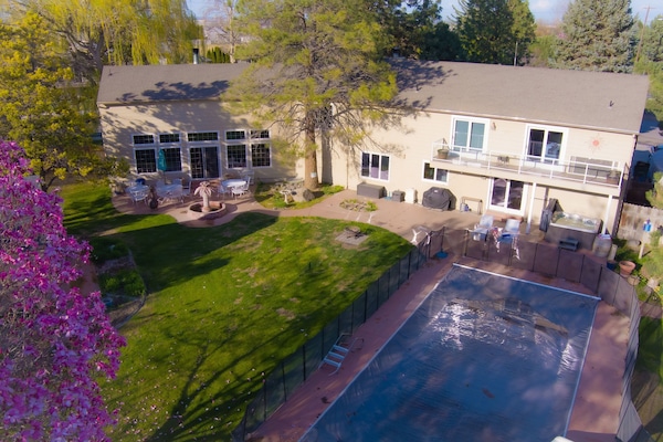 Backyard in the springtime. 
Pool is covered and opens Memorial Day Weekend.