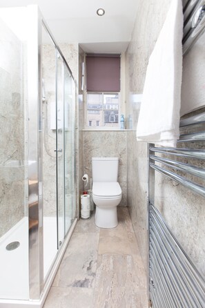 Shower, hair dryer, towels, soap