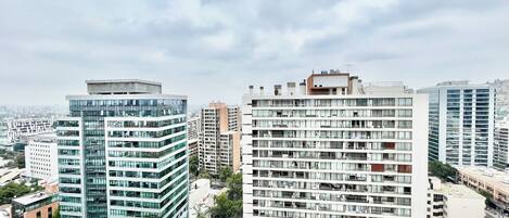A high-rise building with multiple floors, large windows, and a modern architectural design.