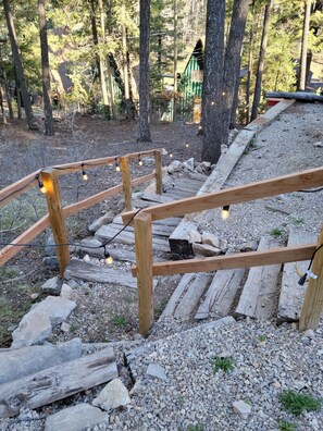 Lighted stairs to access patio entry