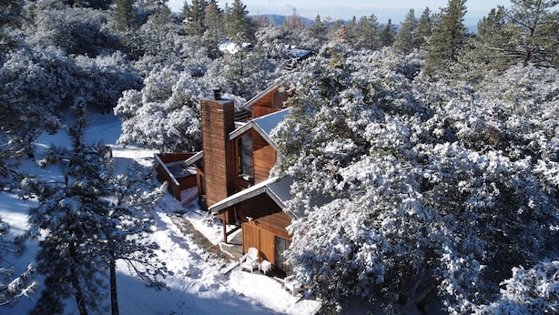 A wooden cabin surrounded by snow-covered trees. - Secluded 1 acre Mountain Home - Hot Tub, 3 Decks & Direct National Forest Access (Idyllwild-Pine Cove)