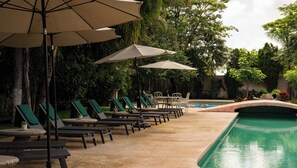 Outdoor pool, open 9:00 AM to 10:00 PM, pool umbrellas