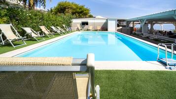 Seasonal outdoor pool, pool loungers