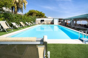 Seasonal outdoor pool, pool loungers