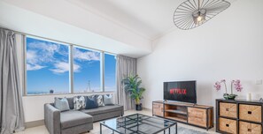 Deluxe Apartment | Living area | 55-cm Smart TV with cable channels, TV