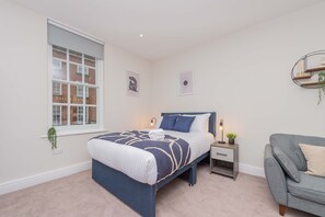 1 غرفة نوم ومكواة/لوح كي وخدمة الإنترنت وملاءات أسرّة