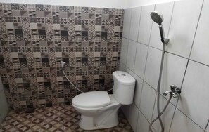 Separate bathtub and shower, rainfall showerhead, free toiletries, soap