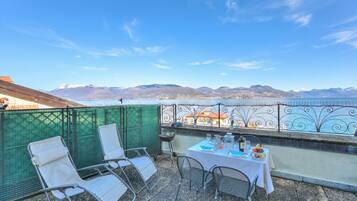 Family Penthouse, Multiple Bedrooms, Beachside (Rooftop On Stresa Lake View) | Outdoor dining