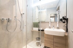 Shower, rainfall showerhead, hair dryer, towels