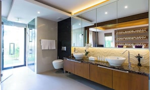 A modern bathroom with a large mirror, two sinks, and a toilet. - Dasiri Lakefront Villa Premium (Hua Hin)