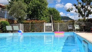 Seasonal outdoor pool, pool loungers