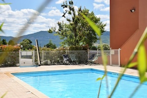 Seasonal outdoor pool, open 9:00 AM to 10:00 PM, sun loungers