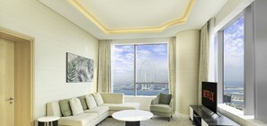 Deluxe Apartment | Living area | 55-inch Smart TV with cable channels, TV