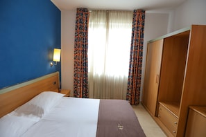 Premium bedding, down duvets, in-room safe, desk