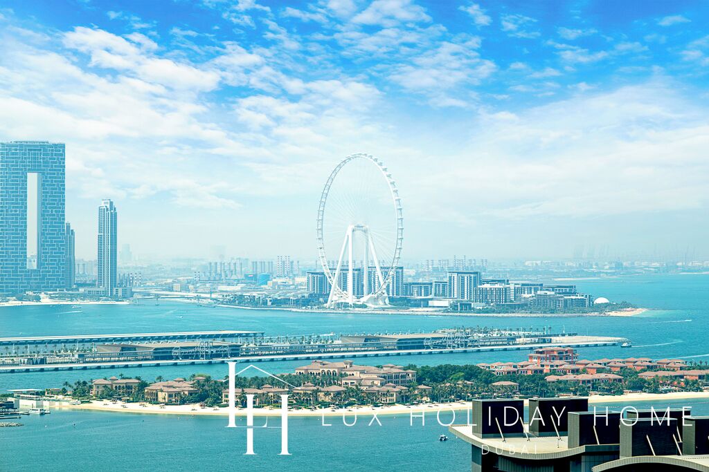 A cityscape with a prominent Ferris wheel, high-rise buildings, and a waterfront.