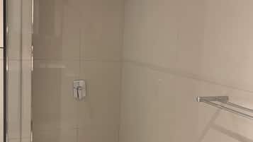 Shower, towels, soap, toilet paper