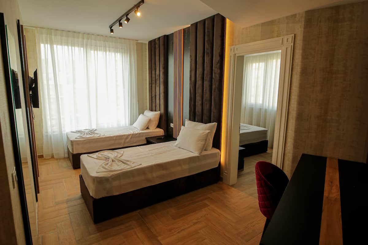 Appartement Deluxe | Minibar, coffre-fort, bureau, accès au Wi-Fi (inclus)