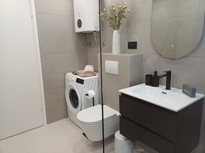 Bathtub, hair dryer, towels