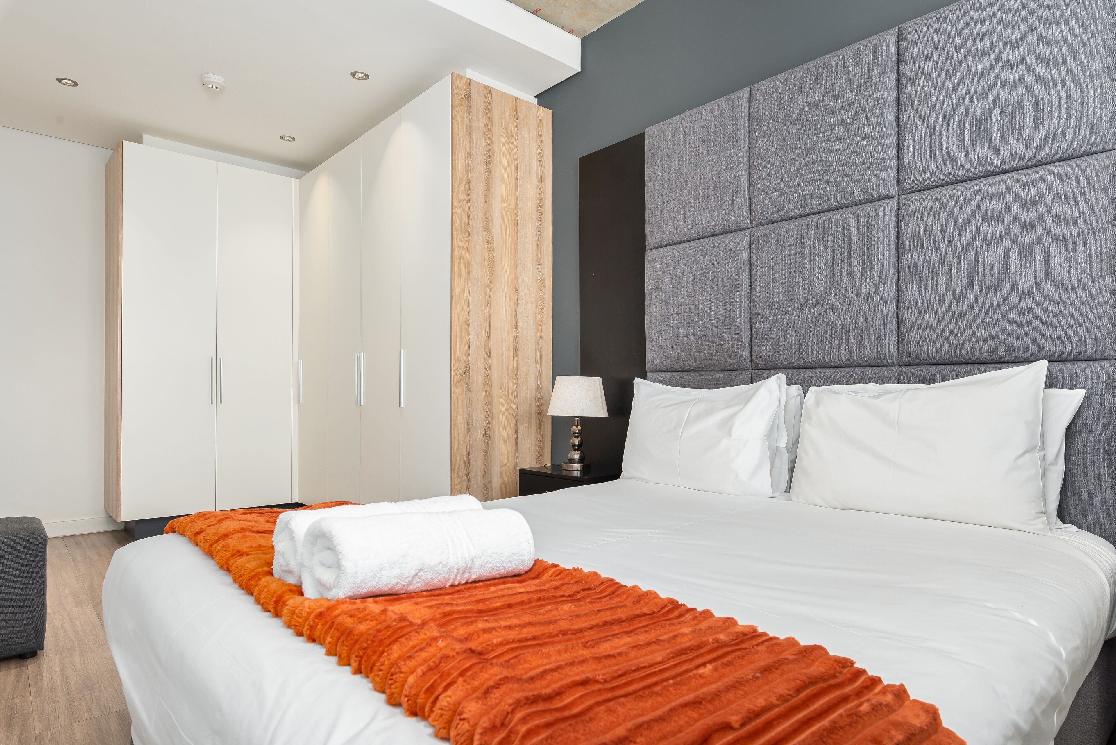 2 bedrooms, premium bedding, laptop workspace, iron/ironing board