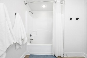 Combined shower/tub, hair dryer, towels, soap