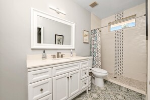 Shower, hair dryer, towels, shampoo